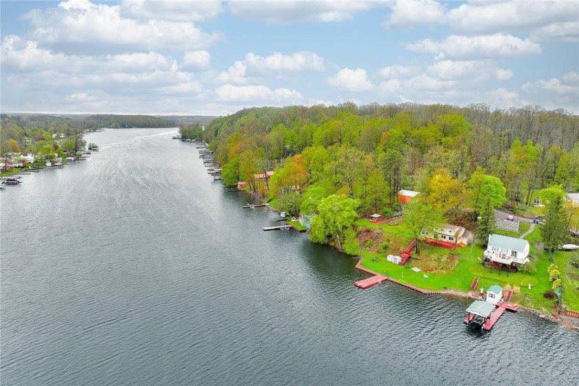 Tucked into the hillside, this awesome lakefront home offers so - photo 4