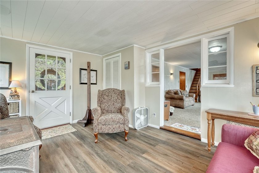 Tucked into the hillside, this awesome lakefront home offers so - photo 6