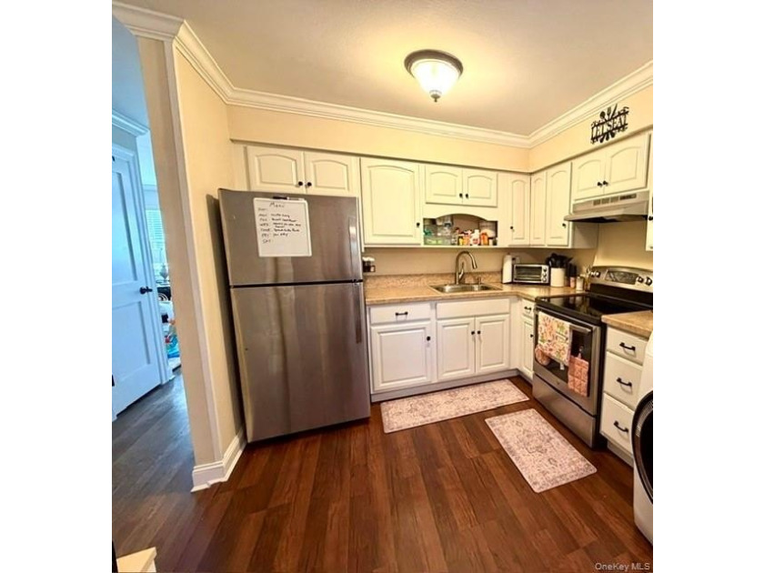 Beautiful County Club Gardens Lower Level Unit Awaits You! This - photo 9