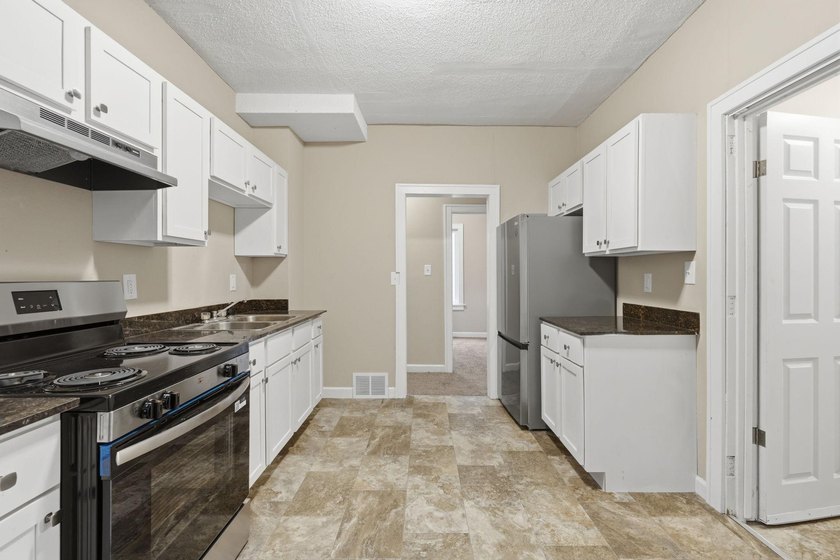 Completely Renovated Duplex with $70K+ in Updates! Exceptional - photo 6