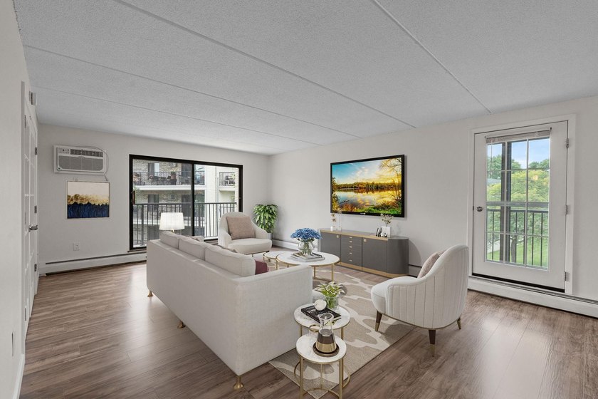 Rare opportunity to own a stunning 4th-floor corner unit in the - photo 2
