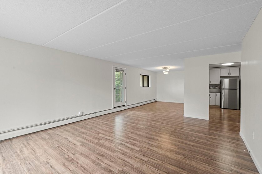 Rare opportunity to own a stunning 4th-floor corner unit in the - photo 6