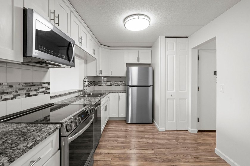 Rare opportunity to own a stunning 4th-floor corner unit in the - photo 9