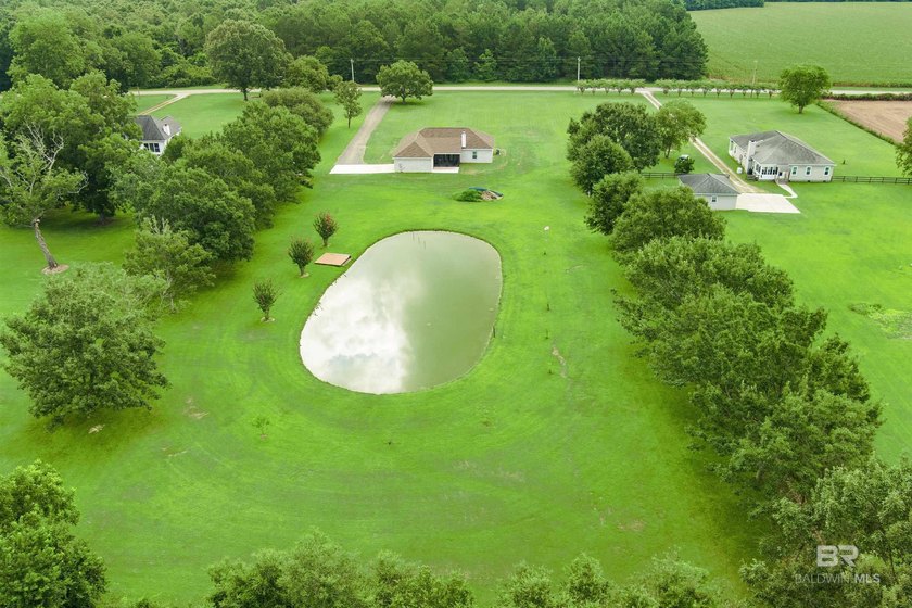 Nestled on nearly three acres of pristine land in Fairhope, this - photo 5