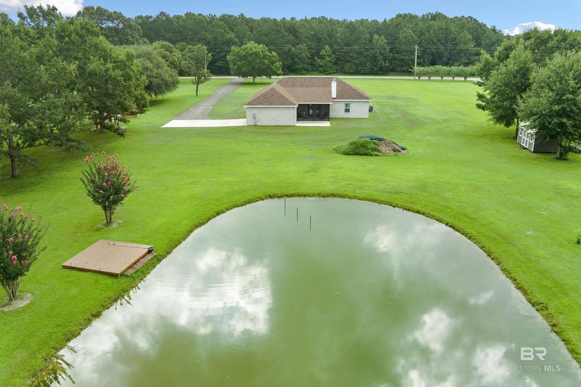 Nestled on nearly three acres of pristine land in Fairhope, this - photo 6