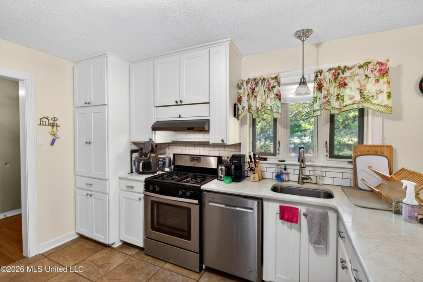 Welcome to this charming 1950's gem nestled in the heart of - photo 13