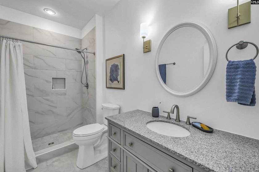 Modern comfort meets relaxed lake living on this spacious 1-acre - photo 11