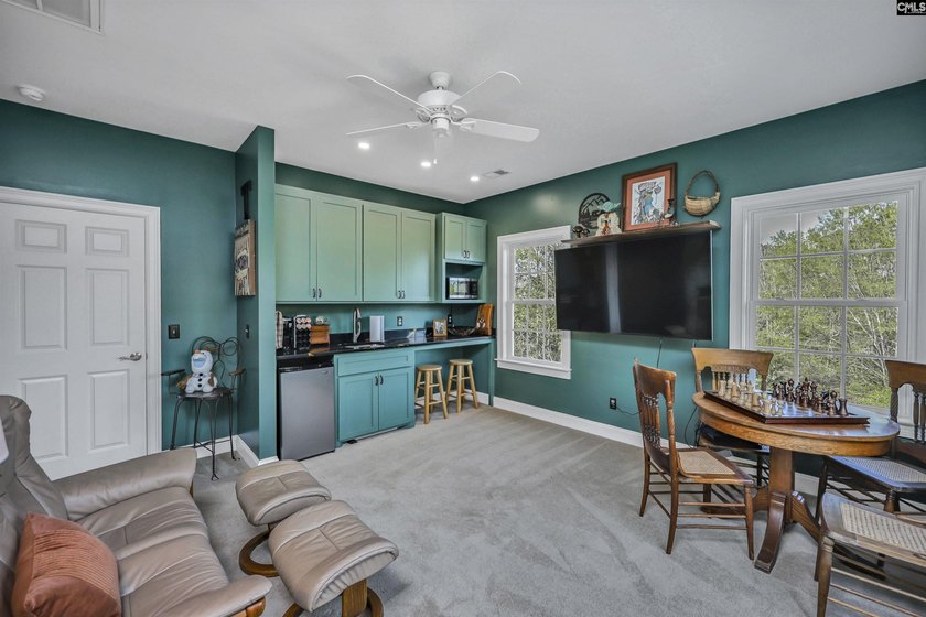 Modern comfort meets relaxed lake living on this spacious 1-acre - photo 13