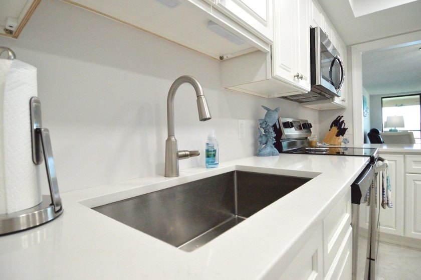 Enjoy waterfront living in this beautifully updated 2-bedroom - photo 11