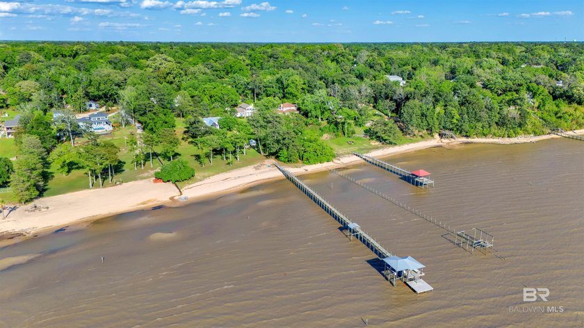 This exquisite bayfront residence features 1.22 acres along the - photo 2