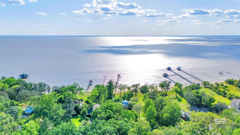 This exquisite bayfront residence features 1.22 acres along the - photo 3