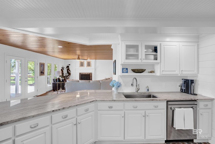 This exquisite bayfront residence features 1.22 acres along the - photo 7
