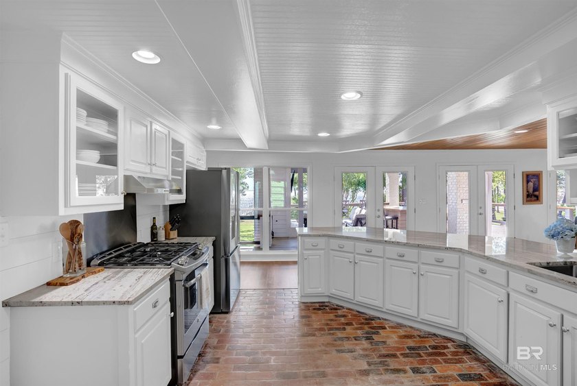 This exquisite bayfront residence features 1.22 acres along the - photo 8