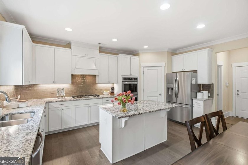 Owner's suite on the main, flexible main-level guest/office - photo 13