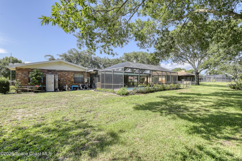 Welcome home to this beautiful 4 bedroom, 2 bath pool home in - photo 49