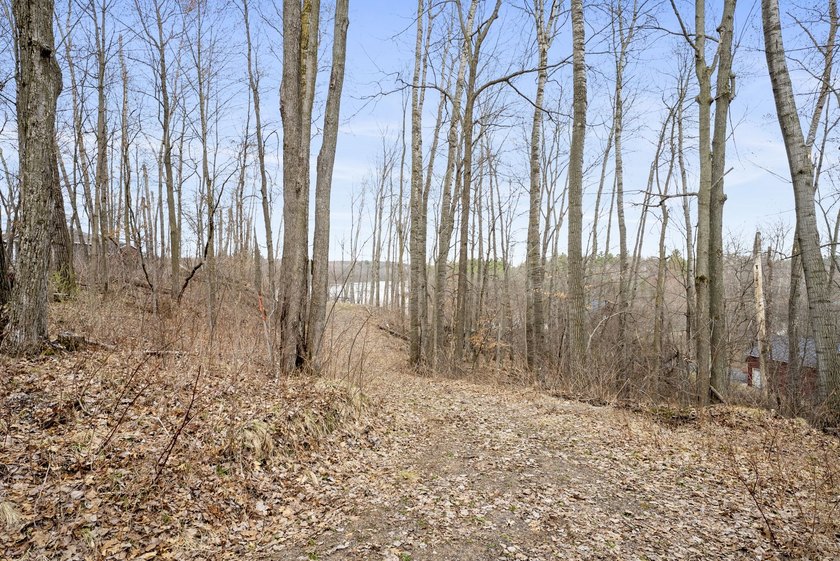 Experience a premier 2.9-acre wooded waterfront lot on Clam - photo 11
