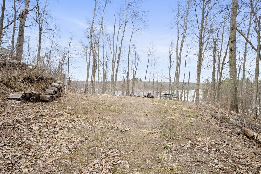 Experience a premier 2.9-acre wooded waterfront lot on Clam - photo 12