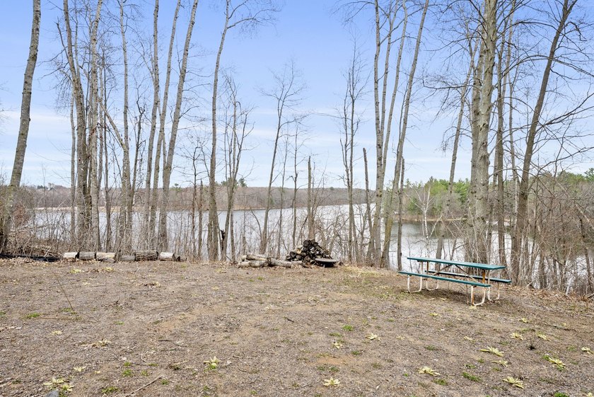 Experience a premier 2.9-acre wooded waterfront lot on Clam - photo 13