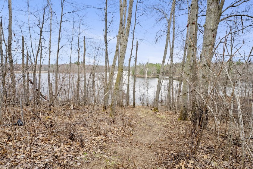 Experience a premier 2.9-acre wooded waterfront lot on Clam - photo 14