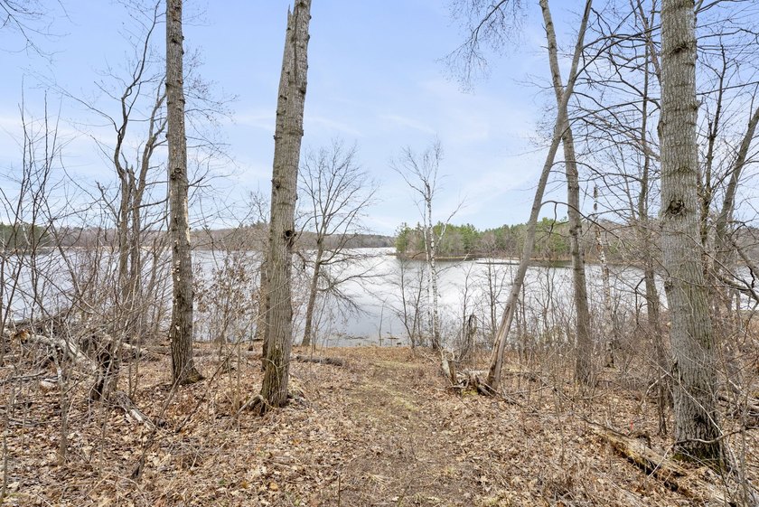 Experience a premier 2.9-acre wooded waterfront lot on Clam - photo 15