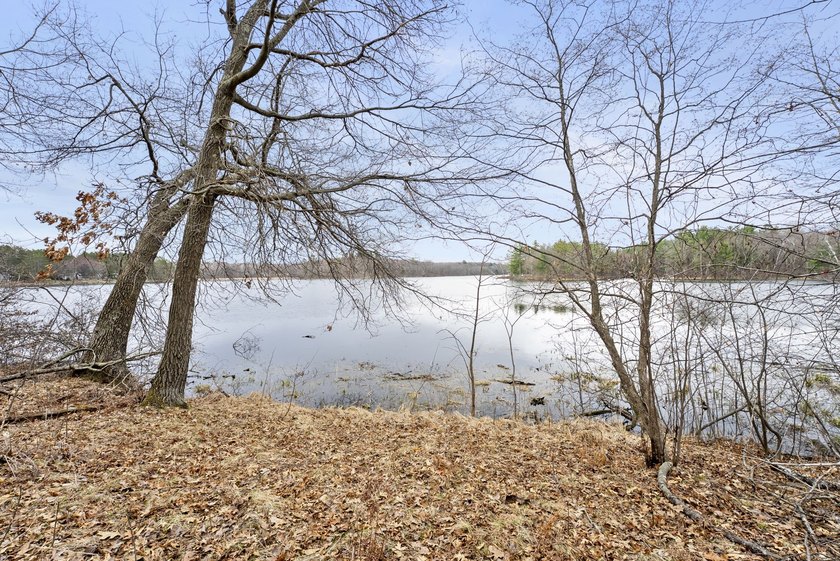 Experience a premier 2.9-acre wooded waterfront lot on Clam - photo 16
