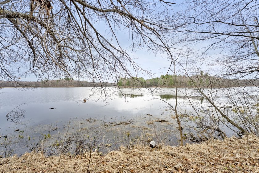Experience a premier 2.9-acre wooded waterfront lot on Clam - photo 17