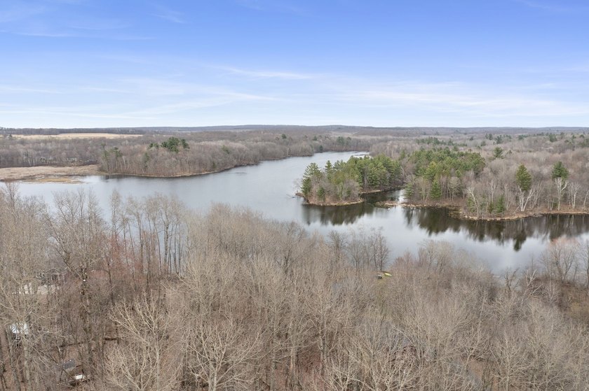 Experience a premier 2.9-acre wooded waterfront lot on Clam - photo 22