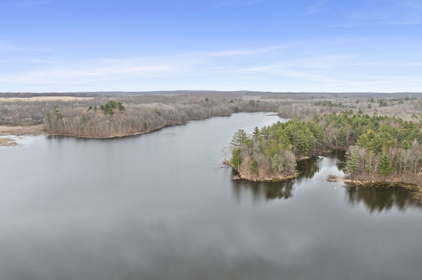 Experience a premier 2.9-acre wooded waterfront lot on Clam - photo 23