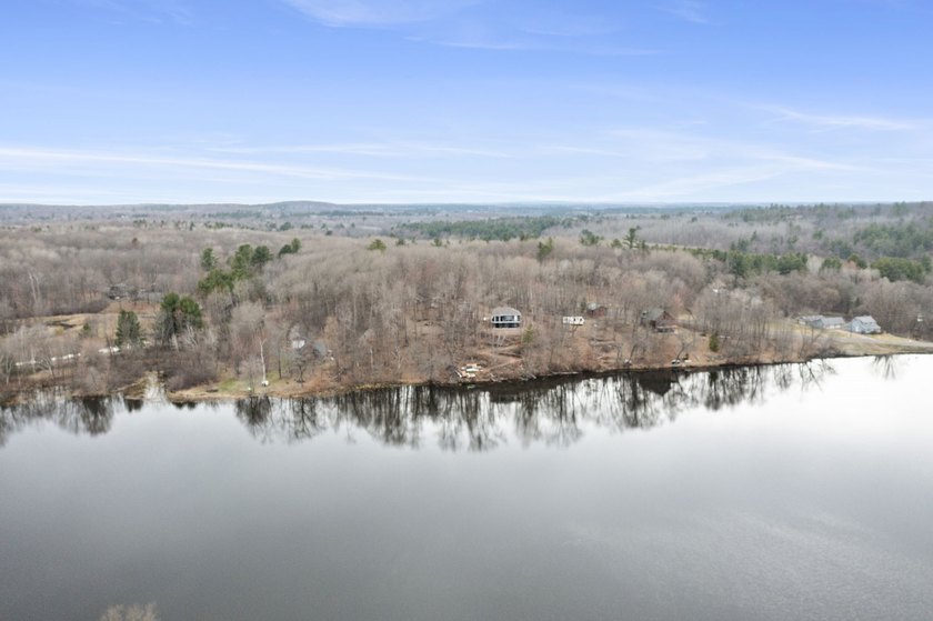 Experience a premier 2.9-acre wooded waterfront lot on Clam - photo 25