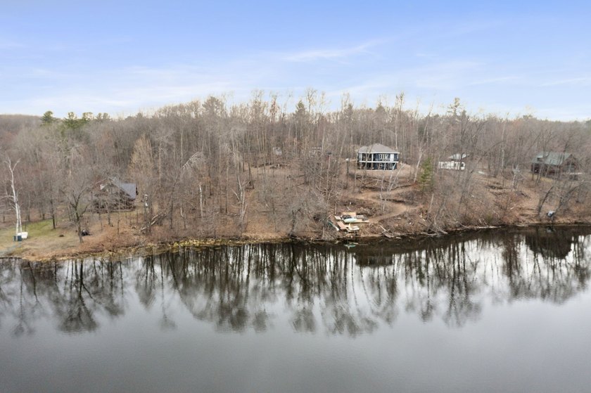 Experience a premier 2.9-acre wooded waterfront lot on Clam - photo 26