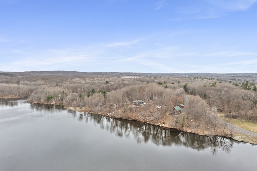 Experience a premier 2.9-acre wooded waterfront lot on Clam - photo 30