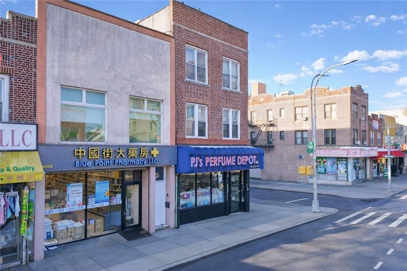 Prime mixed-use brick building located in the heart of the - photo 4