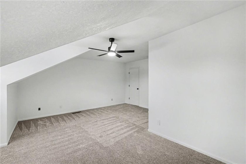 This beautifully updated 1.5-story interior-unit townhome blends - photo 12