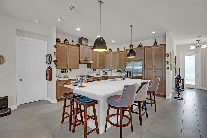 This stunning corner-lot home offers breathtaking lake views and - photo 13