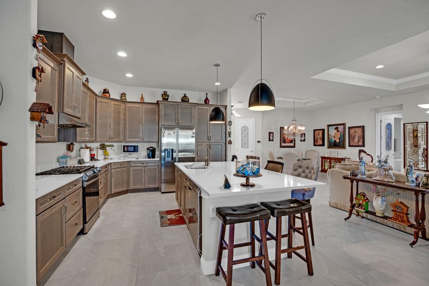 This stunning corner-lot home offers breathtaking lake views and - photo 14