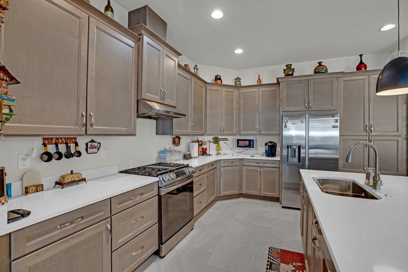 This stunning corner-lot home offers breathtaking lake views and - photo 15