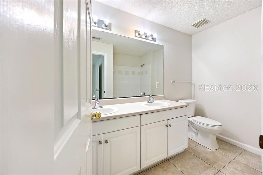 This 3BR/2BA villa at The Estate at Westbury offers a bright - photo 29