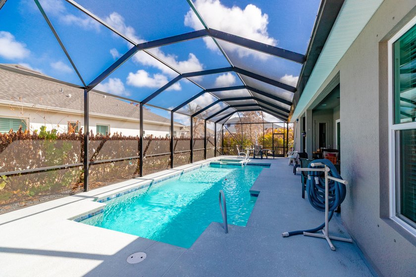 This stunning corner-lot home offers breathtaking lake views and - photo 38