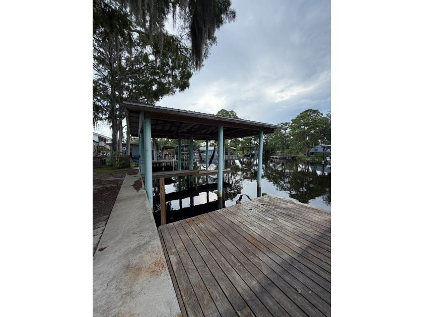 Waterfront paradise with incredible potential! This elevated - photo 3