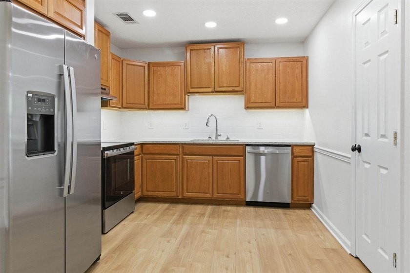 Welcome to your new home! This beautifully remodeled brick home - photo 12