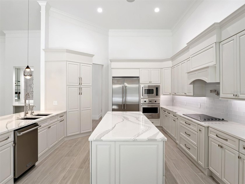 Set within the gates of renowned Isleworth, this beautifully - photo 16