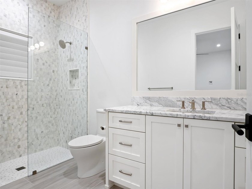 Set within the gates of renowned Isleworth, this beautifully - photo 28