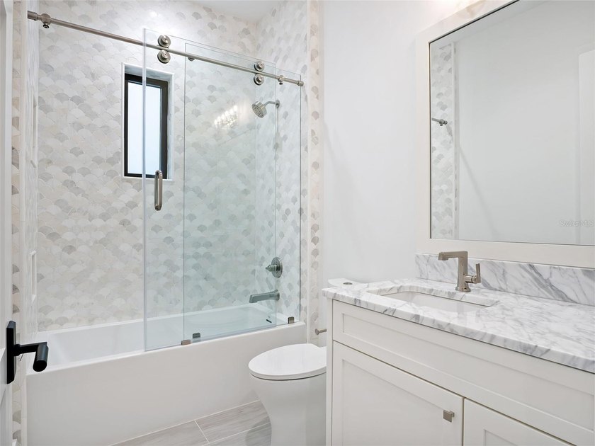 Set within the gates of renowned Isleworth, this beautifully - photo 29