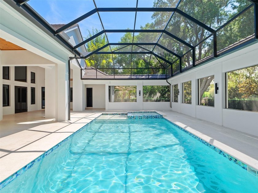 Set within the gates of renowned Isleworth, this beautifully - photo 38