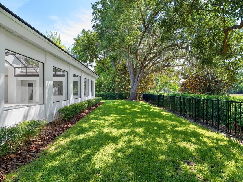 Set within the gates of renowned Isleworth, this beautifully - photo 47