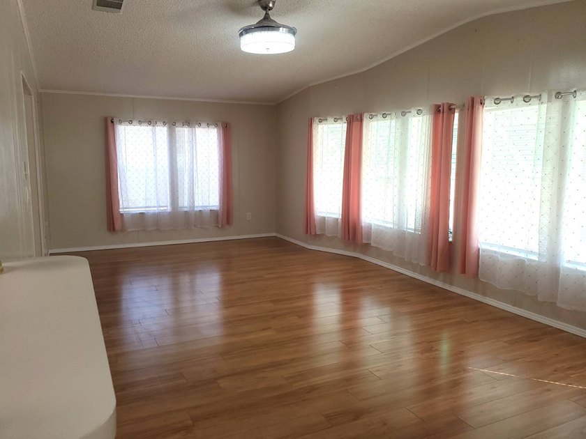 THIS HOME IS ON LEASED LAND WITH A MONTHLY LOT RENT OF $620 AND - photo 11