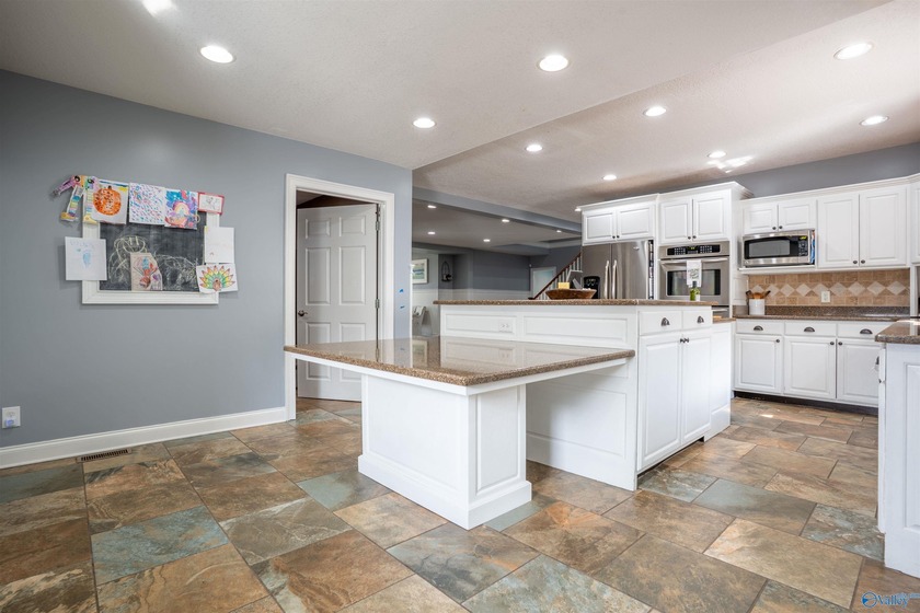 Discover this beautifully remodeled 5,080 sq. ft. home featuring - photo 11