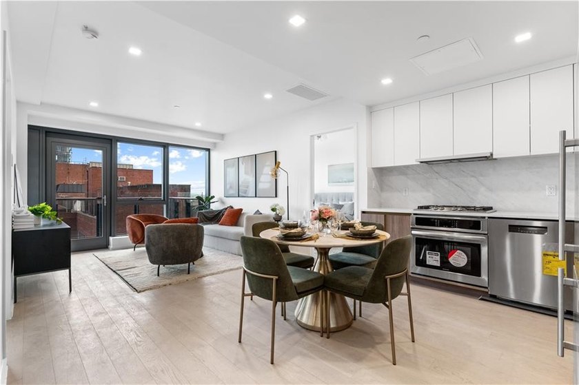 Residence 19H at Bayview Courtyard offers elevated living in a - photo 3