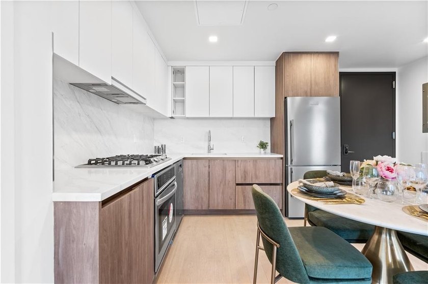 Residence 19H at Bayview Courtyard offers elevated living in a - photo 5