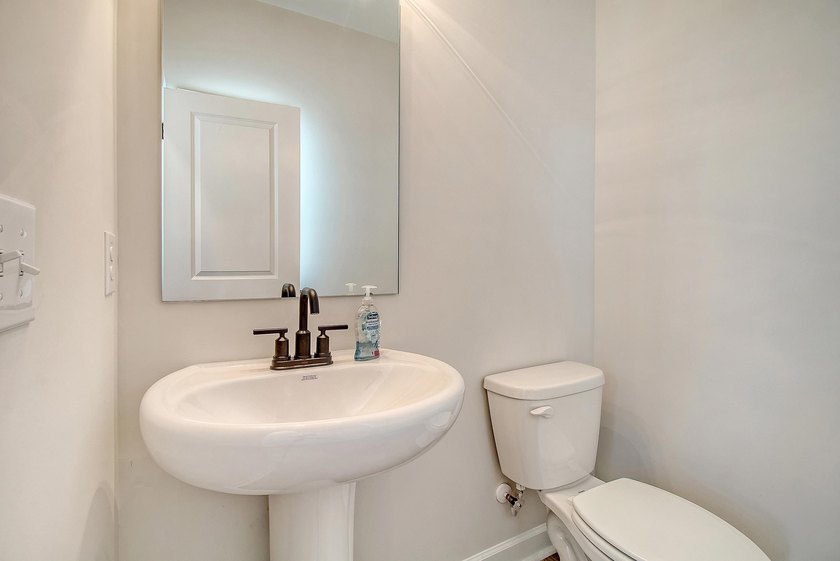 Proudly presenting this exceptional 4-bedroom, 2.5-bathroom home - photo 15